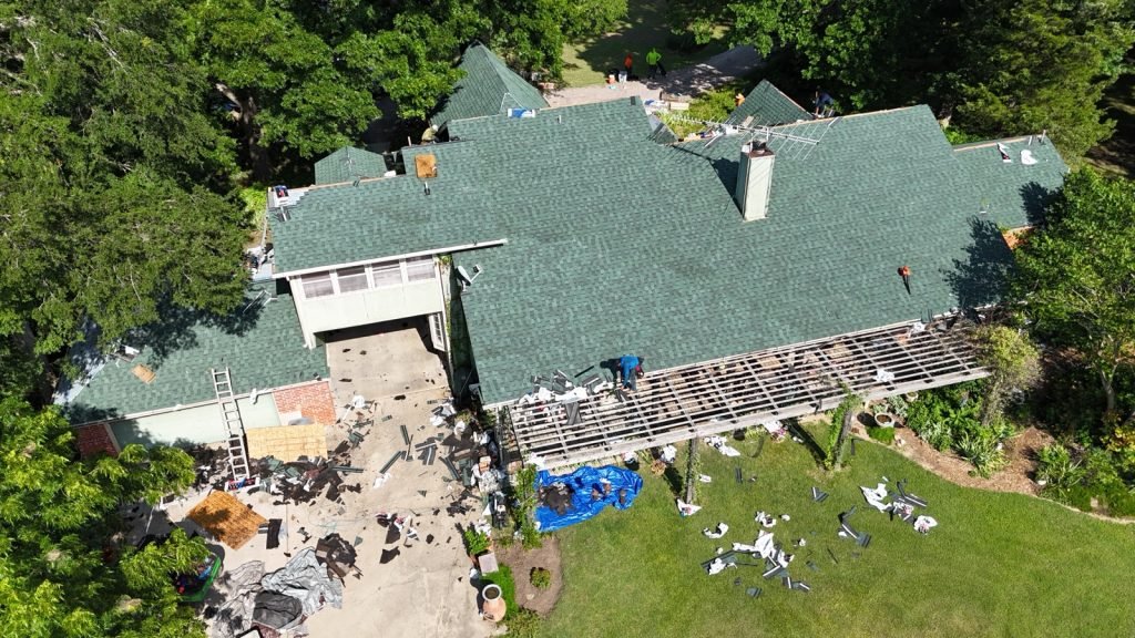 Strong Roofing Texas crew replacing a storm-damaged roof on an insurance claim